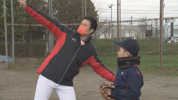 高岸と野球少年